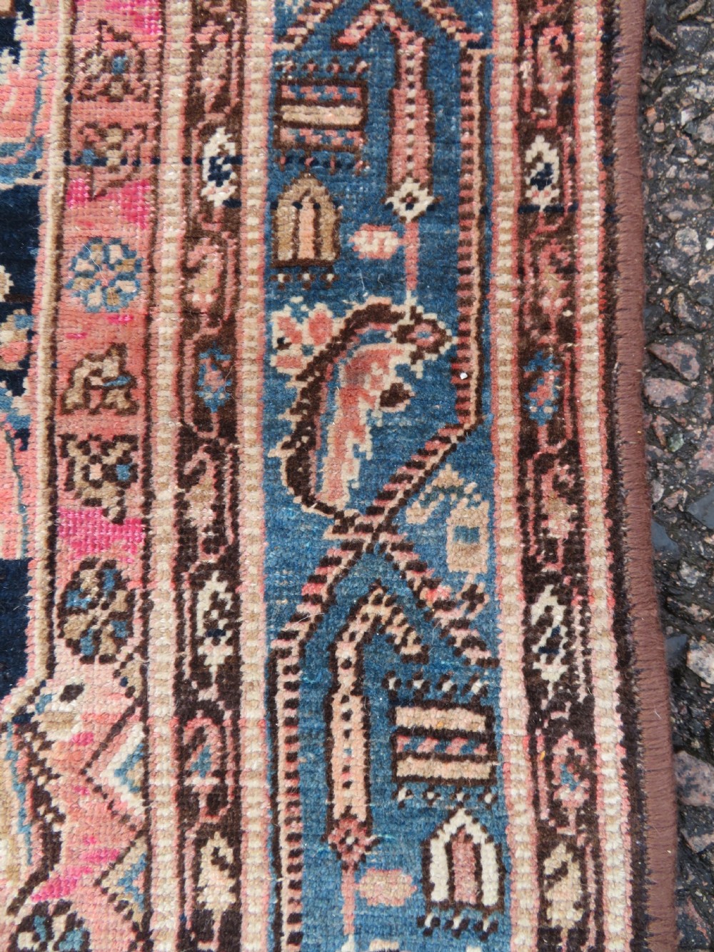 A hand-knotted Bidjar Persian rug featuring a navy blue diamond medallion, salmon pink spandrels, and multi-layered blue floral borders. View VIII