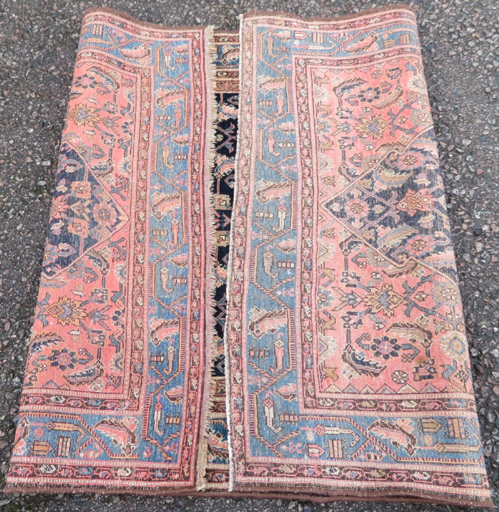A hand-knotted Bidjar Persian rug featuring a navy blue diamond medallion, salmon pink spandrels, and multi-layered blue floral borders. View XVI