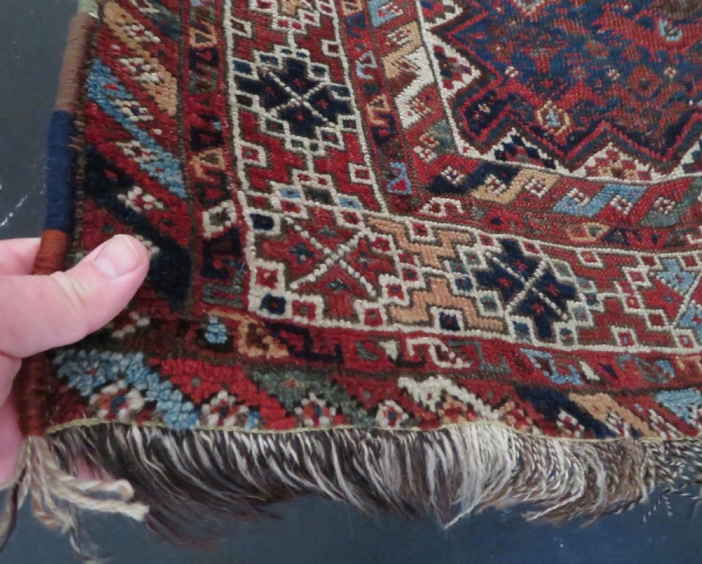 An antique hand-knotted Persian Khamseh rug featuring three diamond central medallions and bird motifs in deep red, navy, cream, and terracotta tones. View XIII