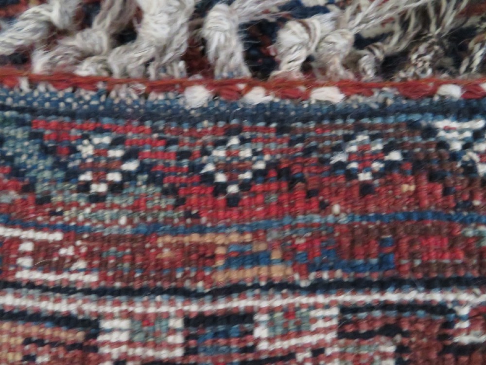 An antique hand-knotted Persian Khamseh rug featuring three diamond central medallions and bird motifs in deep red, navy, cream, and terracotta tones. View XVII