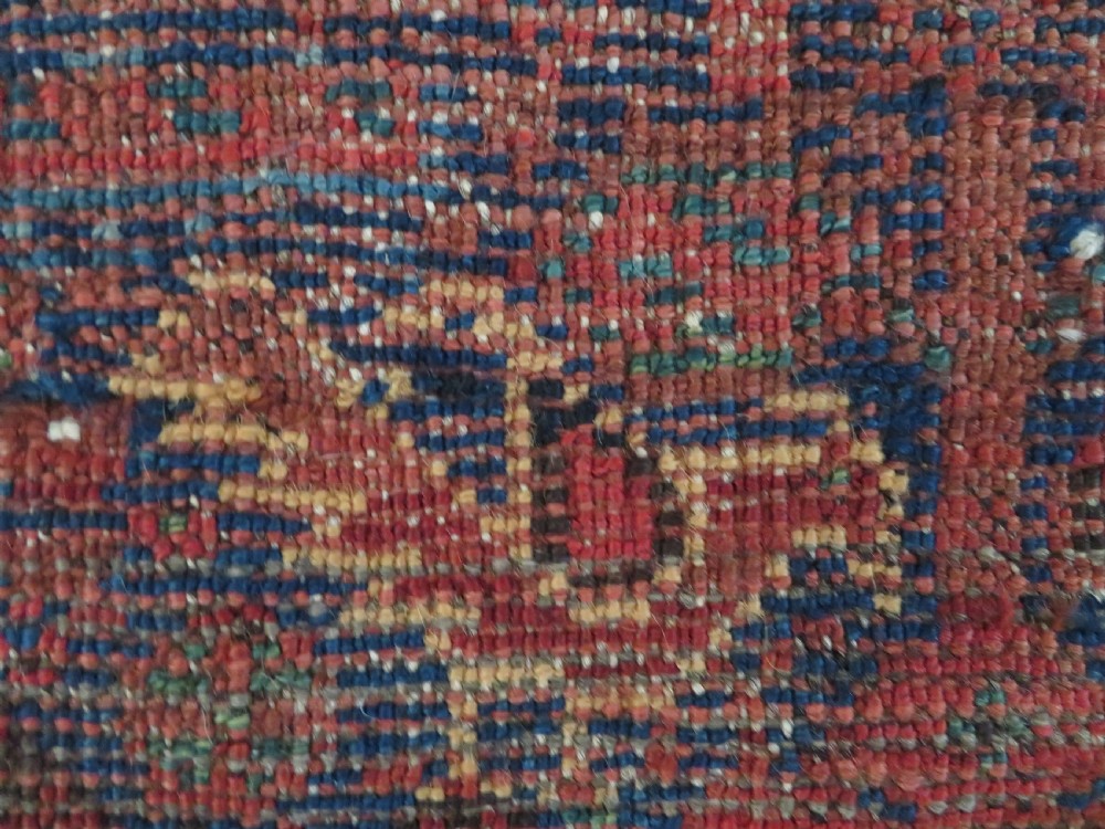 An antique hand-knotted Persian Khamseh rug featuring three diamond central medallions and bird motifs in deep red, navy, cream, and terracotta tones. View XVIII