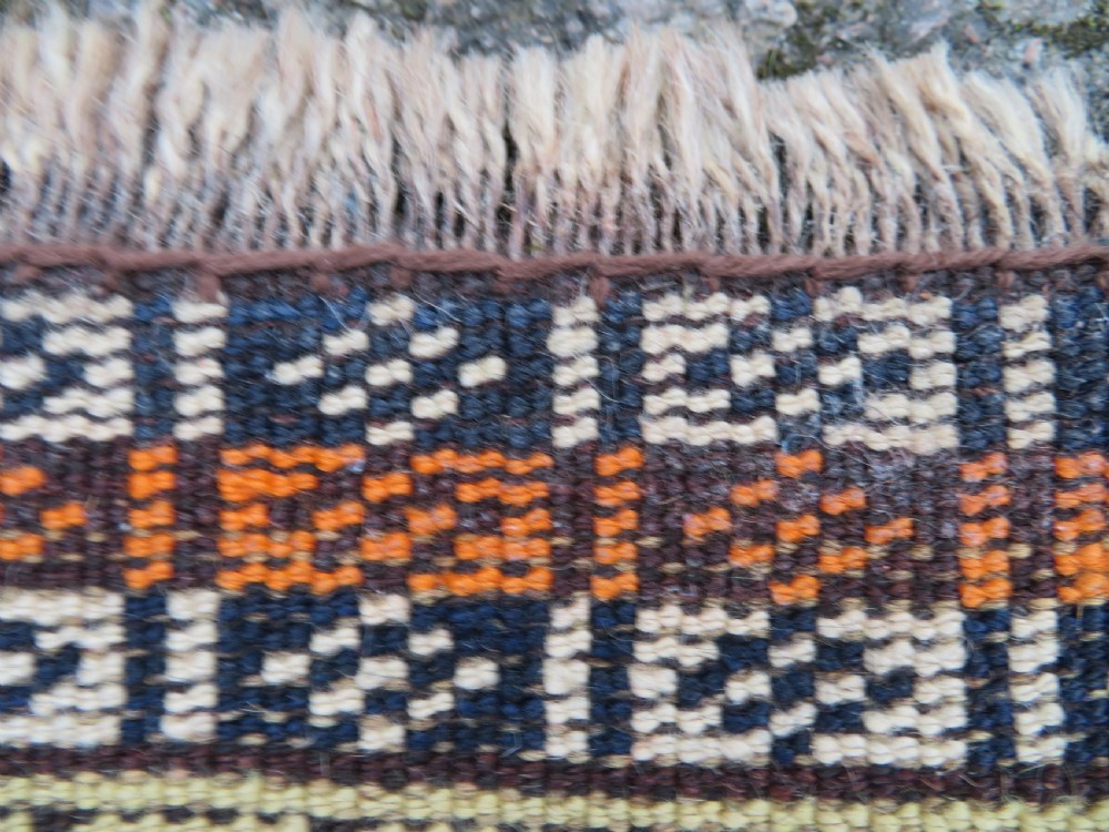 A handwoven Luri tribal rug featuring double geometric diamond medallions in navy blue and red with multi-layered patterned borders. View XX