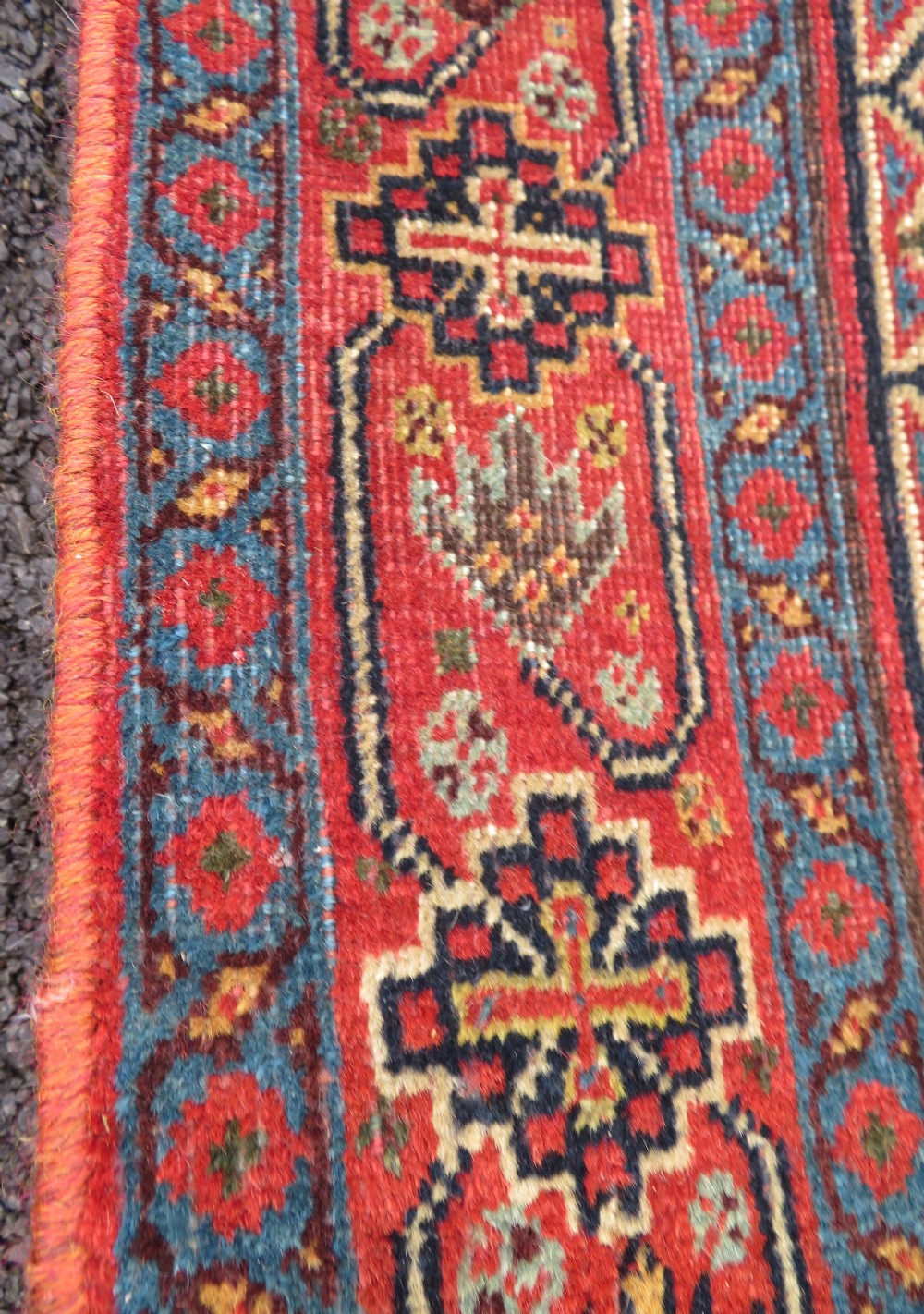 A nineteenth-century hand-knotted Khamseh tribal carpet featuring three diamond-shaped central medallions on an indigo blue field surrounded by geometric borders. View XVIII