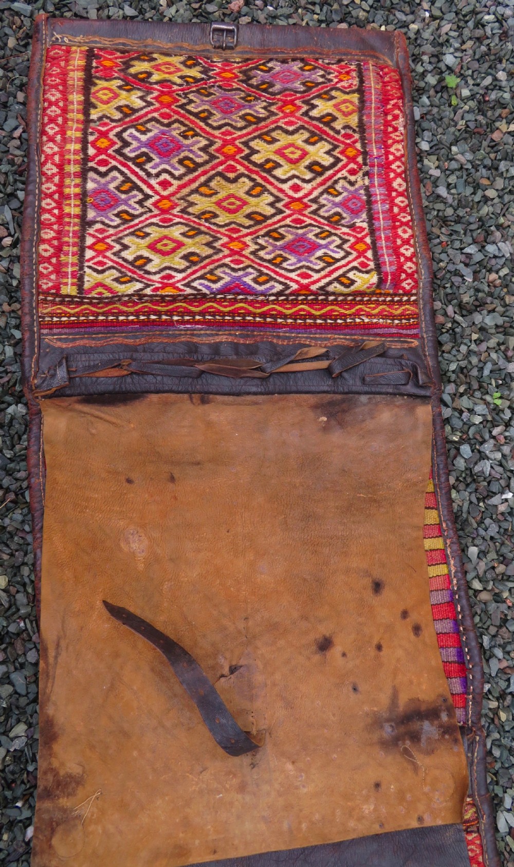 A late 19th-century Shahsavan Persian double saddle bag featuring dark leather flaps and central multi-coloured striped wool flatweave panels. View II