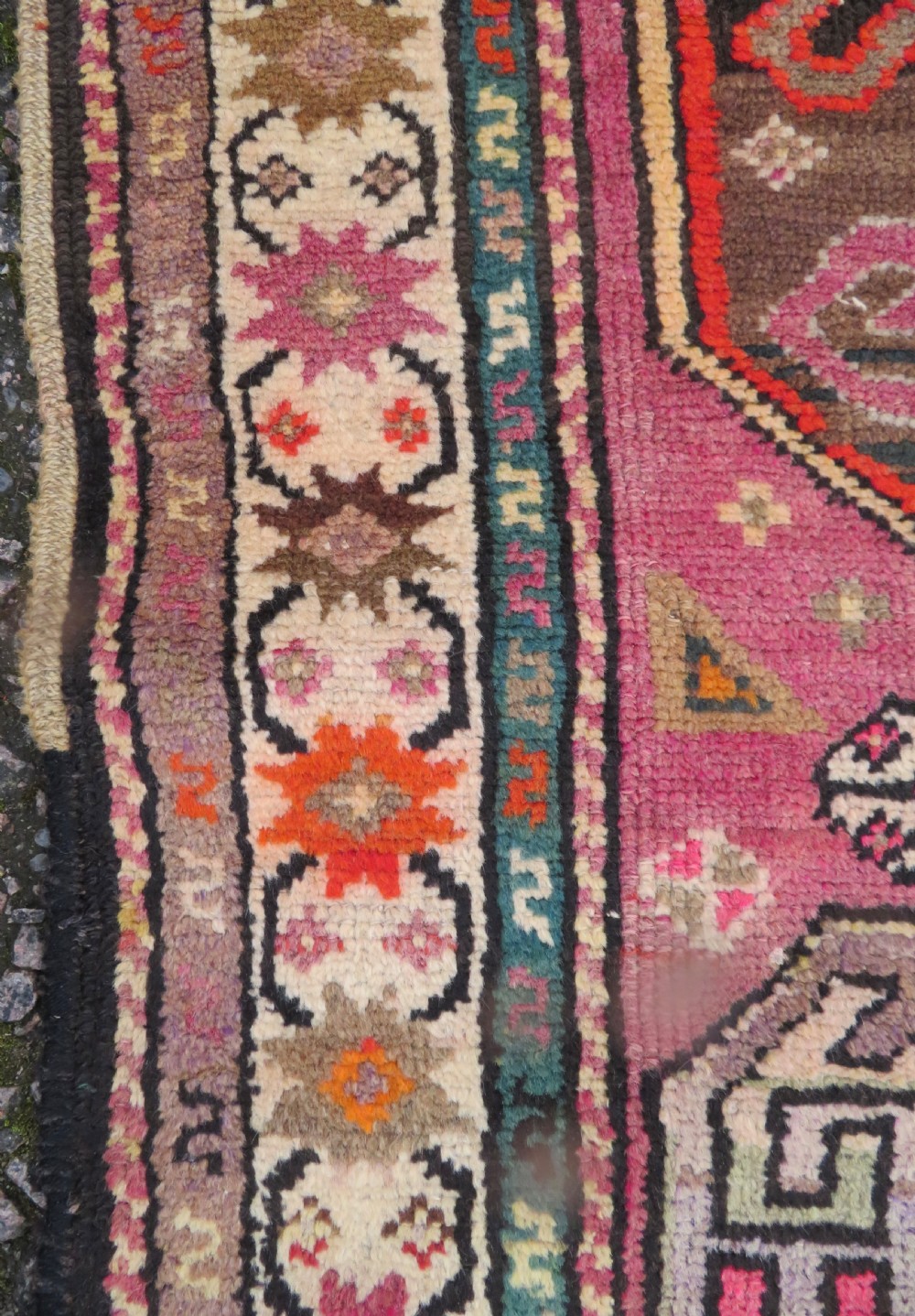 An antique hand-knotted Caucasian Karabagh Chondoresk long runner featuring bold geometric cloudband medallions in shades of red, black, and cream with an ornate decorative border. View VII