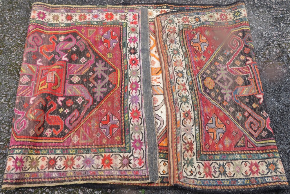An antique hand-knotted Caucasian Karabagh Chondoresk long runner featuring bold geometric cloudband medallions in shades of red, black, and cream with an ornate decorative border. View VIII