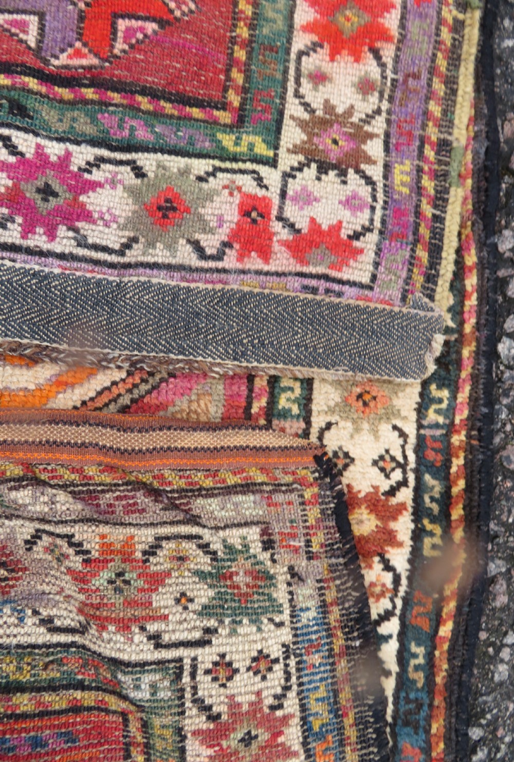 An antique hand-knotted Caucasian Karabagh Chondoresk long runner featuring bold geometric cloudband medallions in shades of red, black, and cream with an ornate decorative border. View XI