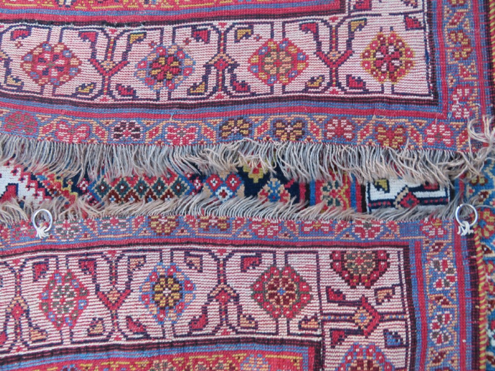 An antique hand-knotted Qashqai Kashkuli wool rug featuring three stacked diamond medallions in red, indigo blue, and ivory surrounded by intricate geometric borders. View XXIV