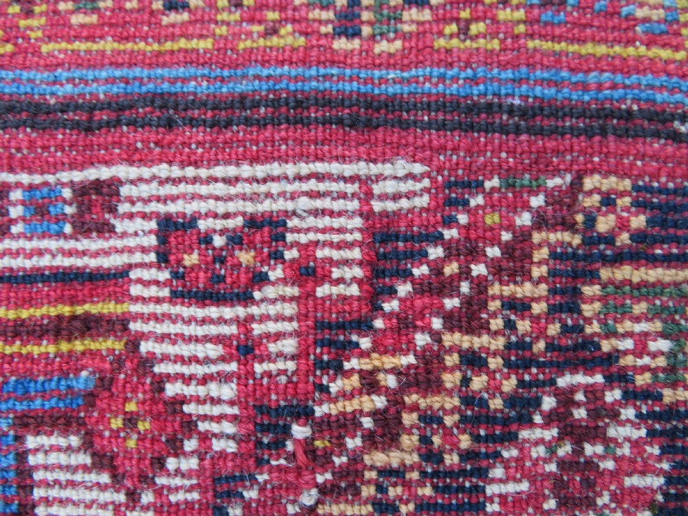 An antique hand-knotted Qashqai Kashkuli wool rug featuring three stacked diamond medallions in red, indigo blue, and ivory surrounded by intricate geometric borders. View XXVI