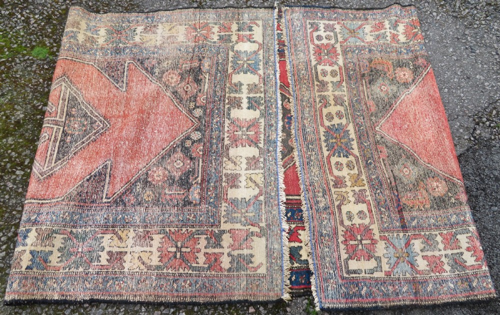 An antique Northwest Persian Zanjan Kelleh rug featuring a red field with diamond medallions surrounded by a wide cream, blue, and red Harshang crab border. View XVII