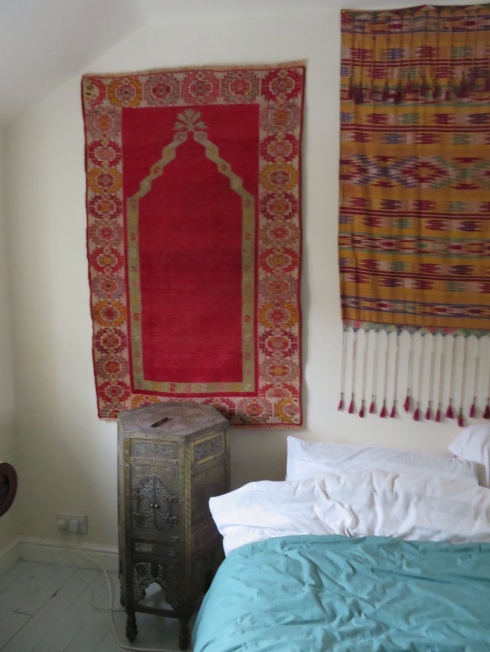 A 19th-century hand-woven Turkish Konya prayer rug featuring a bold crimson red field with a stepped arch niche and geometric borders in yellow, pink, and cream. View XIV