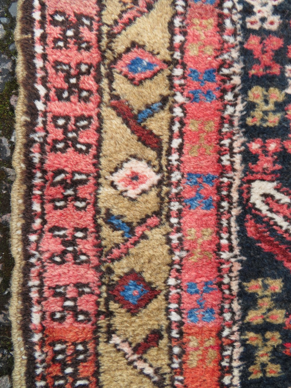 A long hand-knotted Persian Heriz runner rug featuring central geometric medallions in terracotta red and navy blue bordered by intricate geometric patterns. View VIII