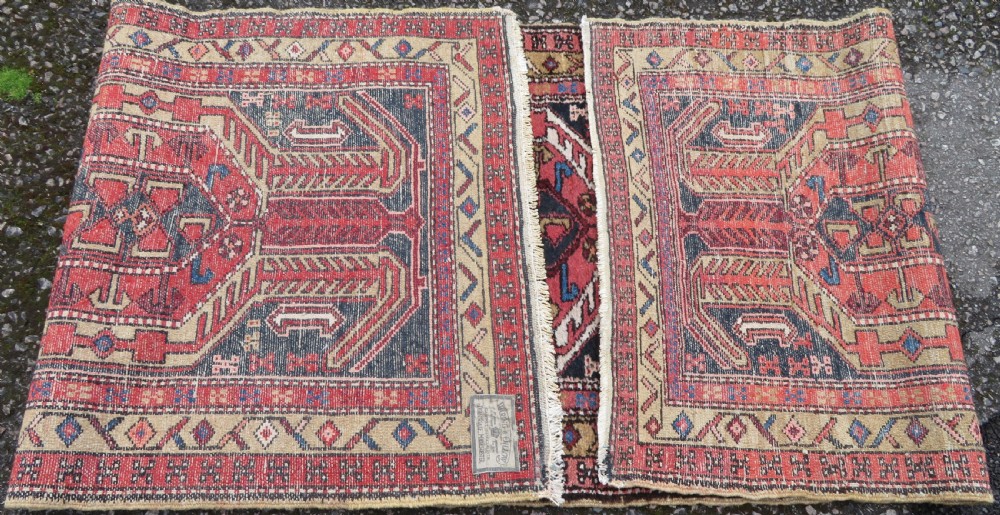 A long hand-knotted Persian Heriz runner rug featuring central geometric medallions in terracotta red and navy blue bordered by intricate geometric patterns. View XI