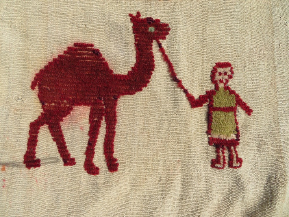 An antique cream handwoven wool Qashqai horse cover featuring colourful geometric patterns, human and camel motifs, and decorative edge tassels. View V