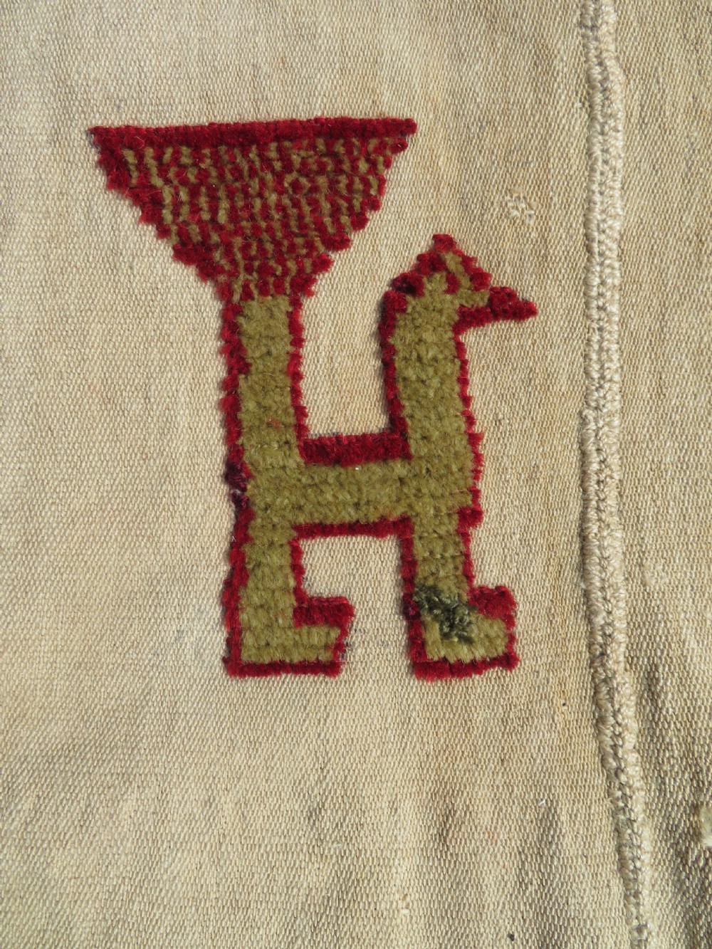 An antique cream handwoven wool Qashqai horse cover featuring colourful geometric patterns, human and camel motifs, and decorative edge tassels. View VI