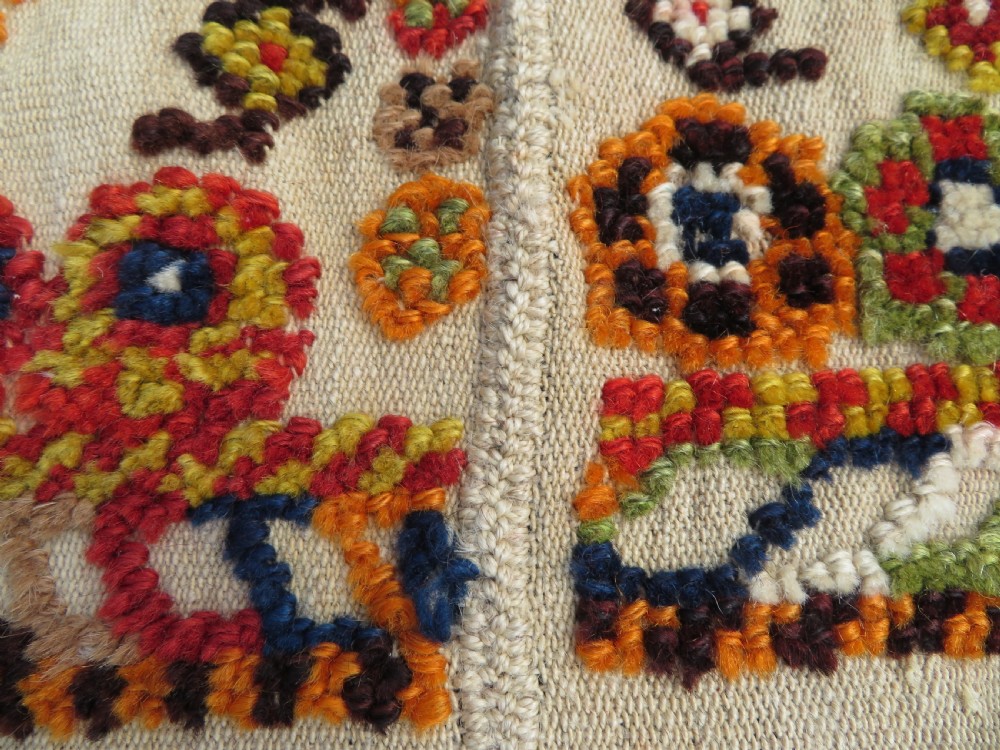An antique cream handwoven wool Qashqai horse cover featuring colourful geometric patterns, human and camel motifs, and decorative edge tassels. View XVI