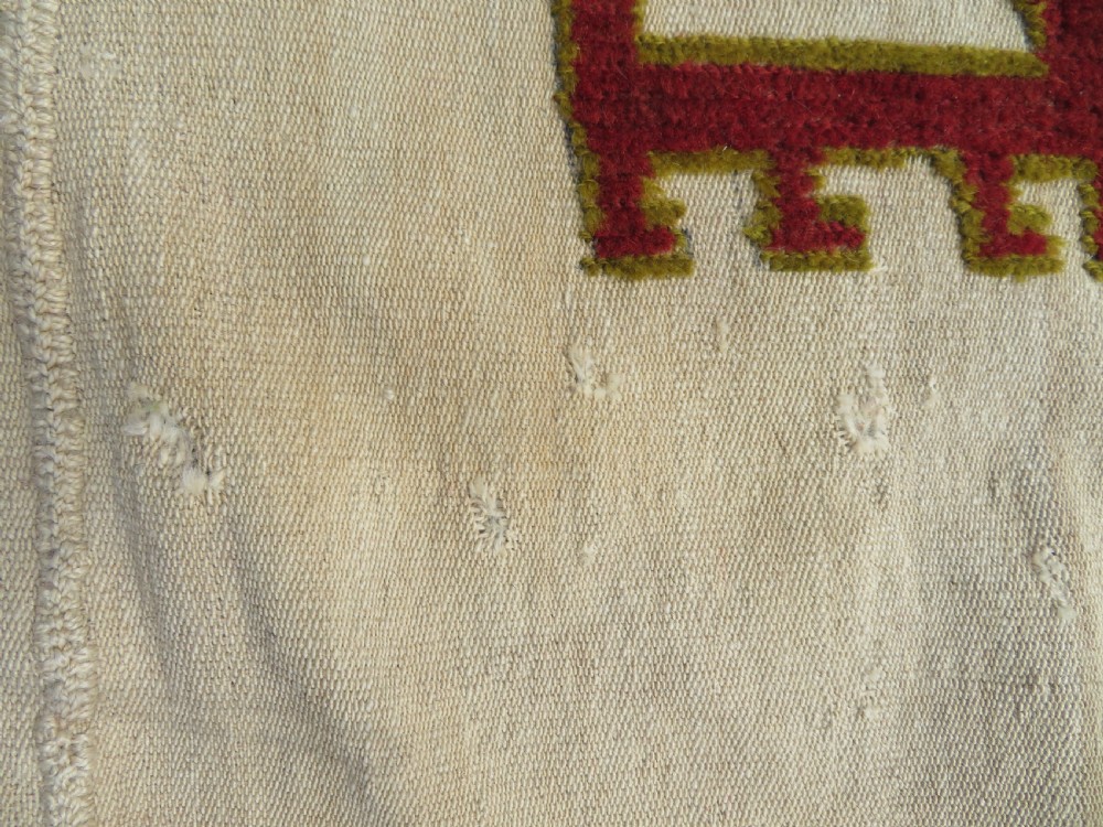 An antique cream handwoven wool Qashqai horse cover featuring colourful geometric patterns, human and camel motifs, and decorative edge tassels. View XIX