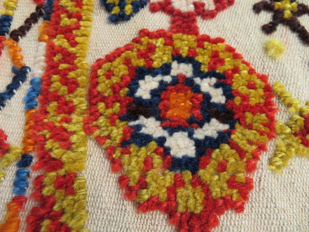 An antique cream handwoven wool Qashqai horse cover featuring colourful geometric patterns, human and camel motifs, and decorative edge tassels. View XXI