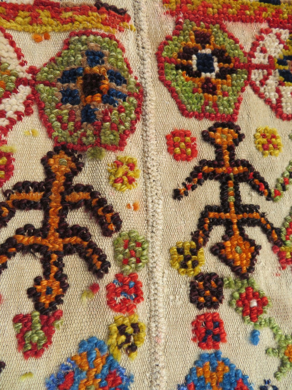 An antique cream handwoven wool Qashqai horse cover featuring colourful geometric patterns, human and camel motifs, and decorative edge tassels. View XXII