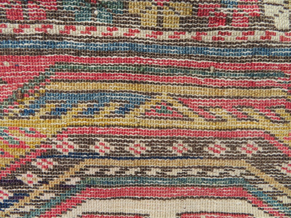 An antique Caucasian Shirvan wool runner rug with repeating geometric octagonal medallions framed by intricate multi-coloured borders. View XI