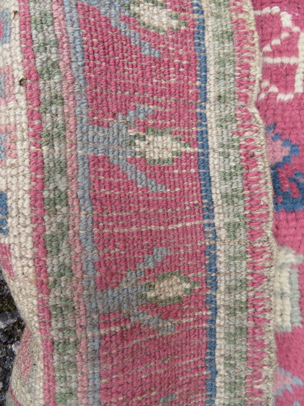 An antique Turkish Bergama wool carpet featuring a red central field surrounded by sage green areas with geometric Holbein square medallions and detailed borders. View XI