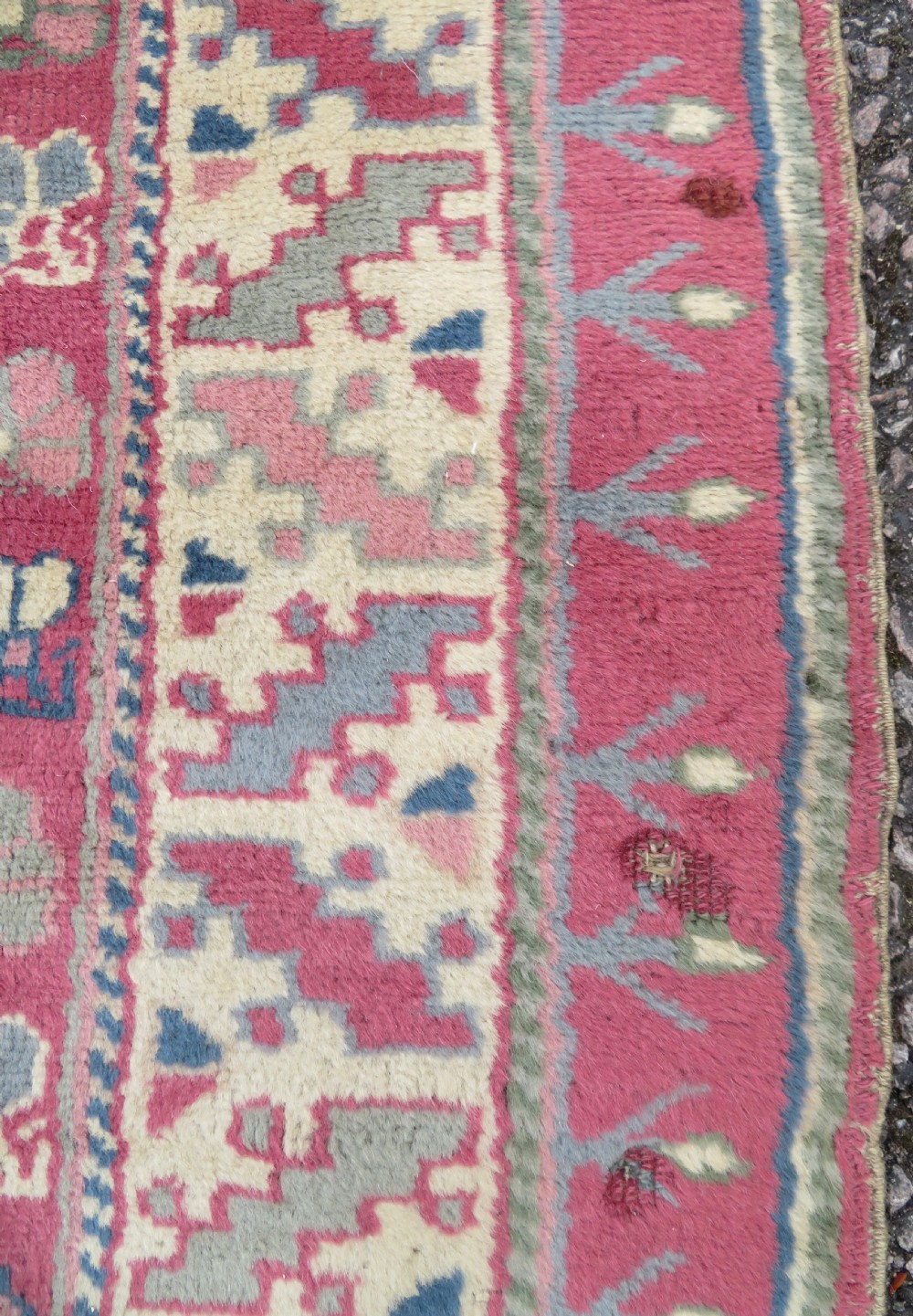 An antique Turkish Bergama wool carpet featuring a red central field surrounded by sage green areas with geometric Holbein square medallions and detailed borders. View XXI