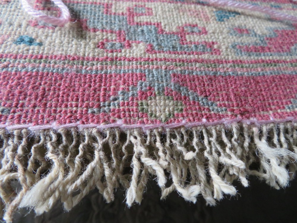 An antique Turkish Bergama wool carpet featuring a red central field surrounded by sage green areas with geometric Holbein square medallions and detailed borders. View XXIII
