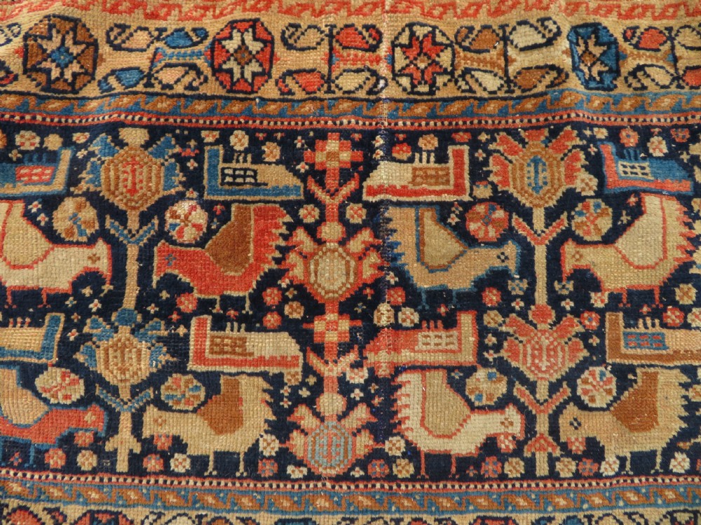 A 19th-century Khamseh hand-knotted wool bag face featuring stylised bird motifs framed by intricate geometric borders in navy blue, terracotta, and ochre. View III