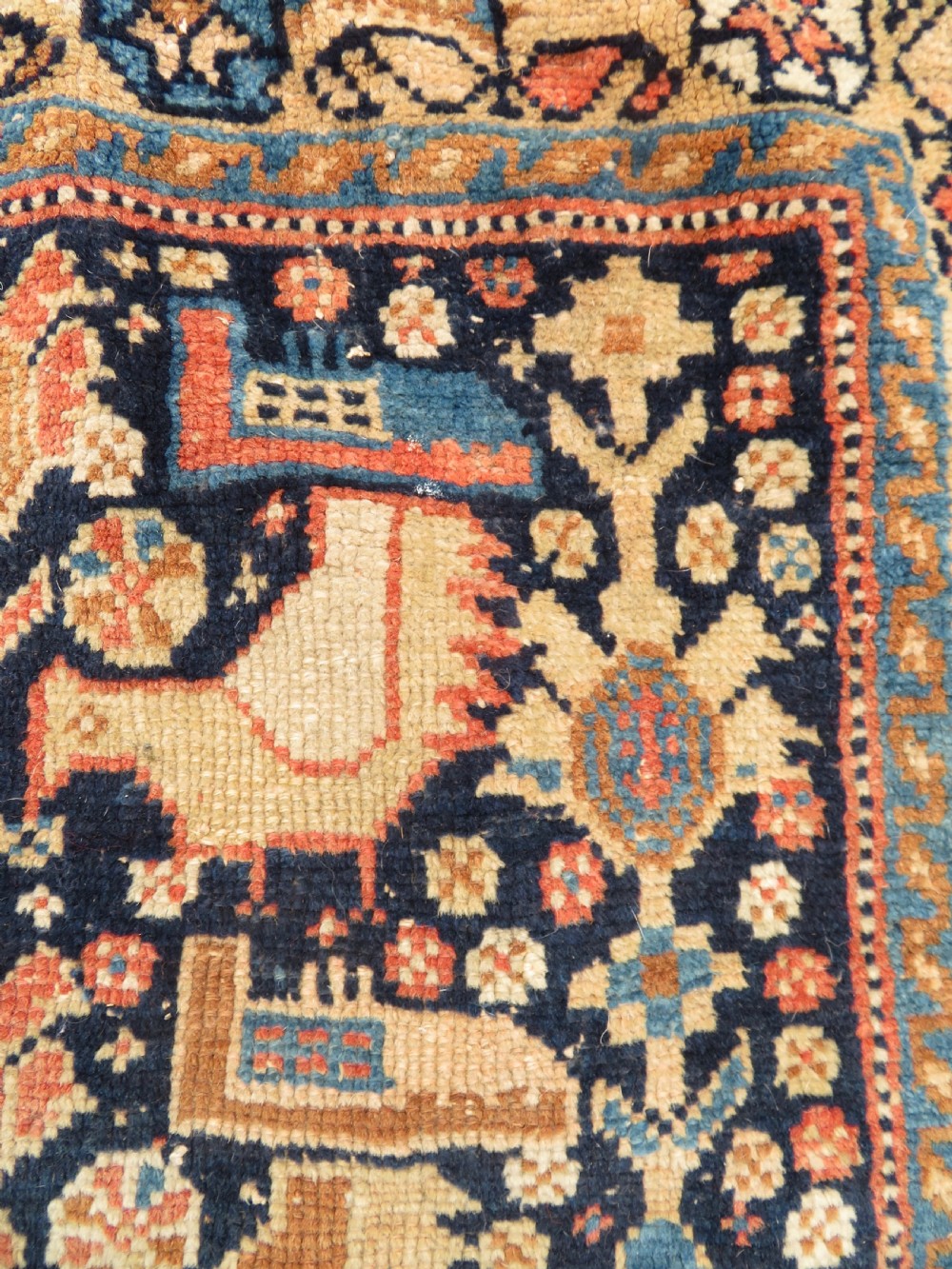 A 19th-century Khamseh hand-knotted wool bag face featuring stylised bird motifs framed by intricate geometric borders in navy blue, terracotta, and ochre. View VI