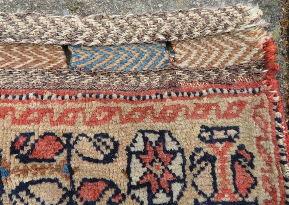 A 19th-century Khamseh hand-knotted wool bag face featuring stylised bird motifs framed by intricate geometric borders in navy blue, terracotta, and ochre. View IX