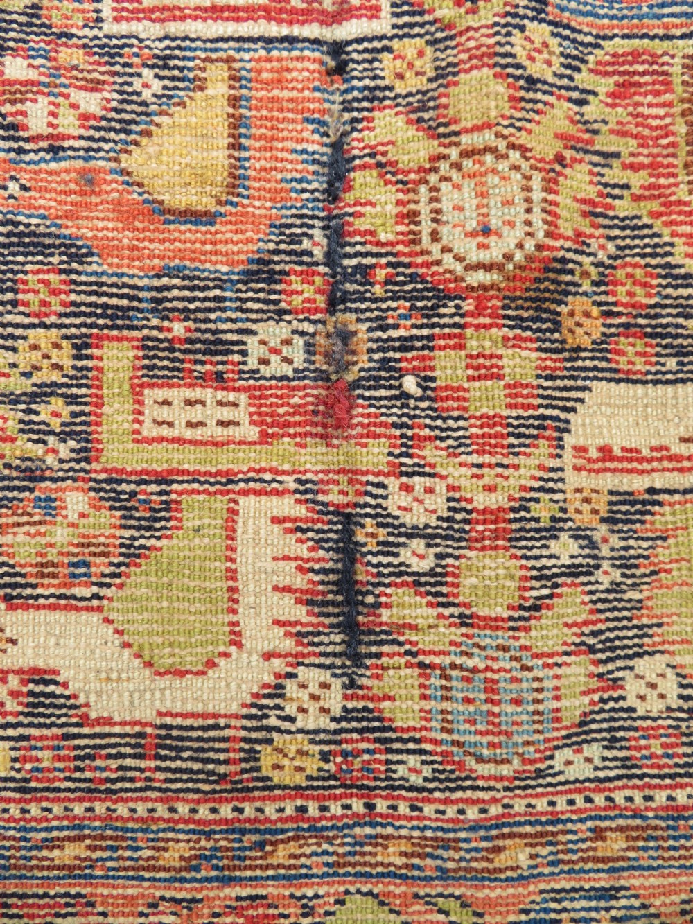 A 19th-century Khamseh hand-knotted wool bag face featuring stylised bird motifs framed by intricate geometric borders in navy blue, terracotta, and ochre. View XIII