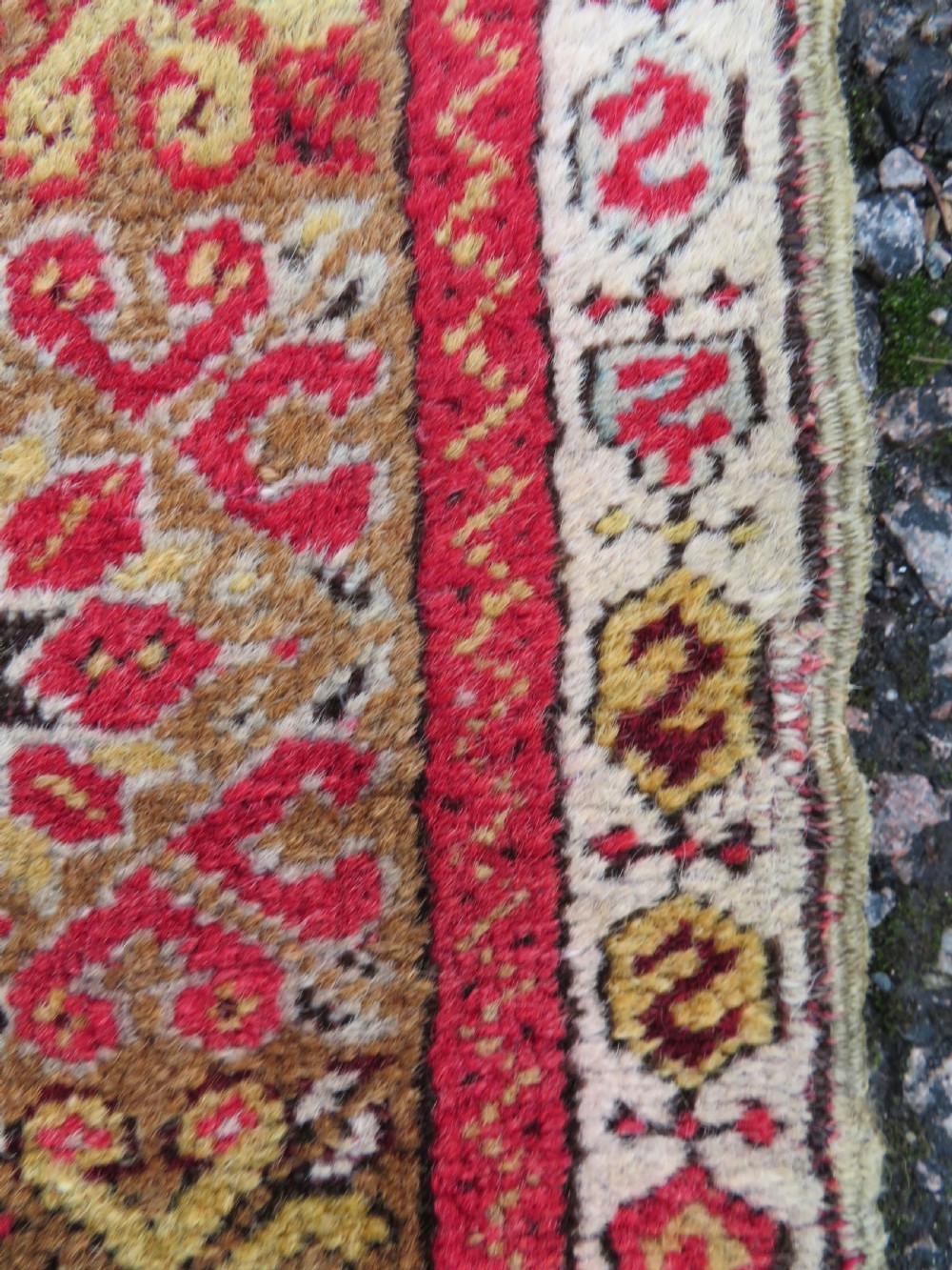 A mid-19th-century hand-knotted Turkish Mudjur prayer rug with a red central mihrab niche framed by geometric floral patterned borders. View VII
