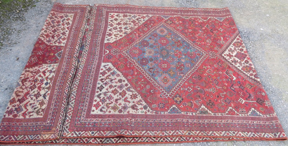 A long hand-knotted antique Persian Khamseh carpet featuring geometric diamond medallions and intricate tribal motifs in red, blue, and cream tones. View XXIII