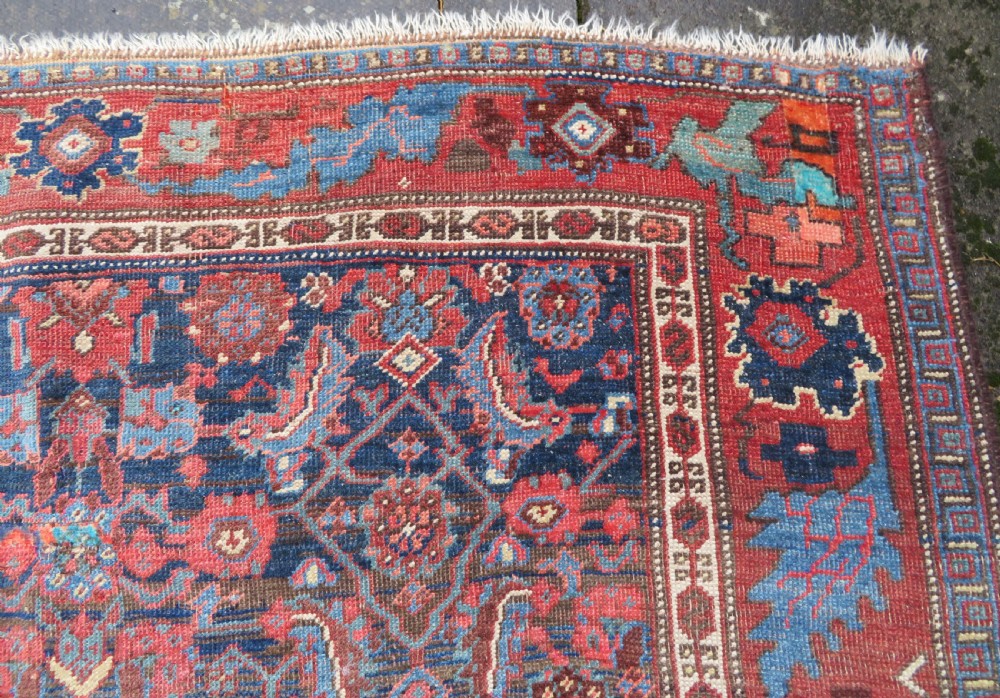 An antique Persian Bidjar Kelleh wool long rug featuring a central navy blue geometric botanical field surrounded by terracotta and blue borders. View XI
