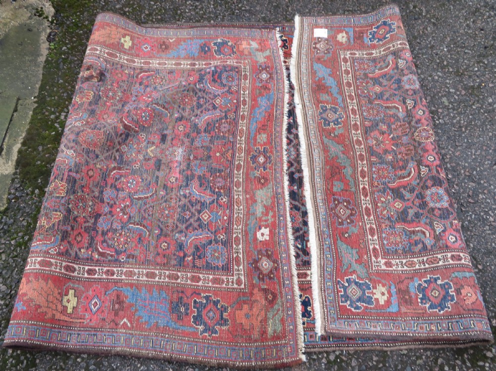 An antique Persian Bidjar Kelleh wool long rug featuring a central navy blue geometric botanical field surrounded by terracotta and blue borders. View XIV