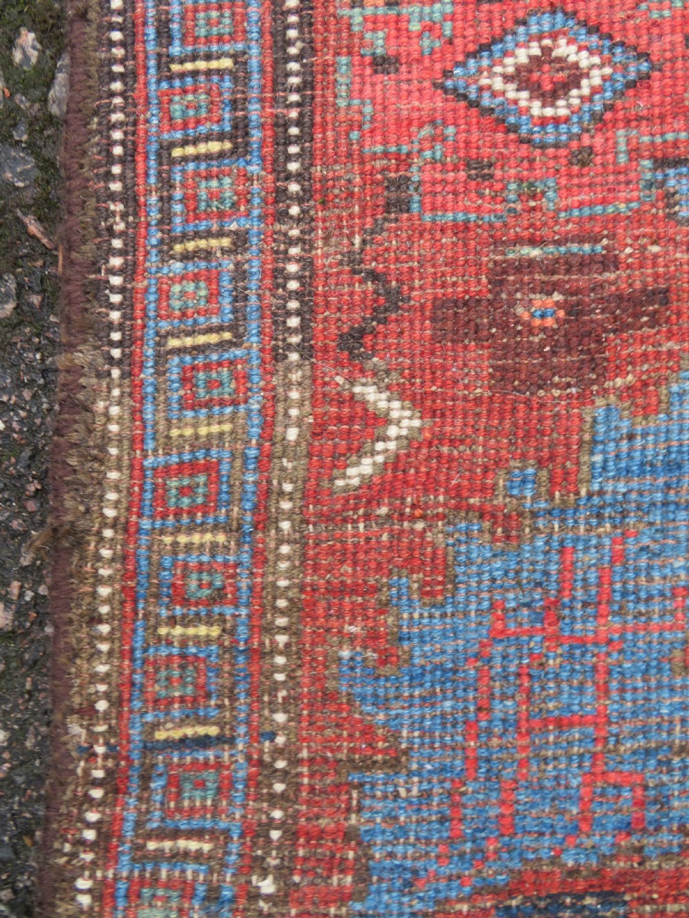 An antique Persian Bidjar Kelleh wool long rug featuring a central navy blue geometric botanical field surrounded by terracotta and blue borders. View XVIII