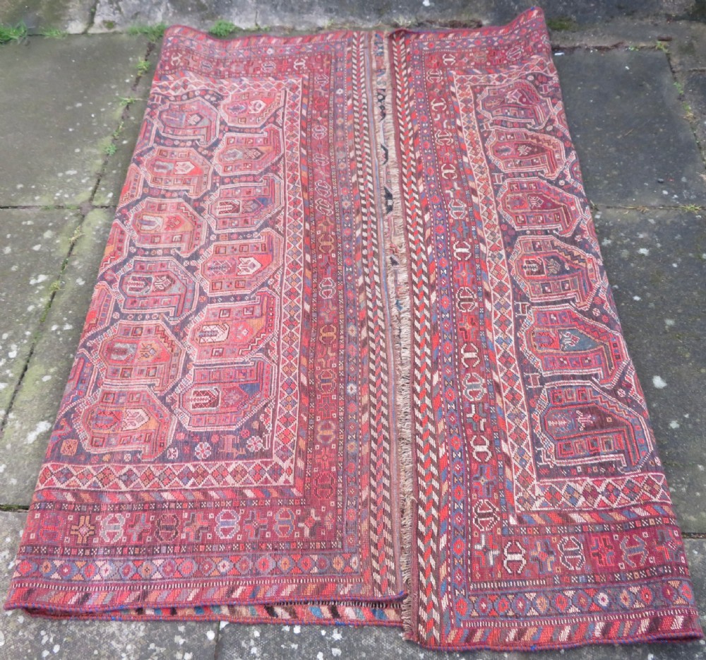 An antique Khamseh hand-knotted wool carpet featuring repeating stylised boteh motifs on a dark navy field with multi-banded geometric borders. View XXI