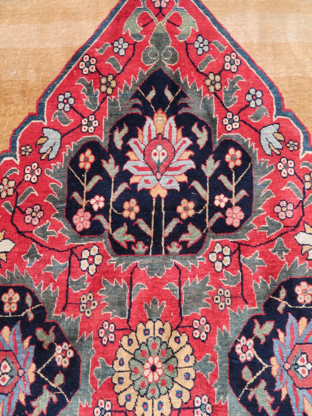 A large hand-knotted antique Persian Bidjar carpet featuring a gold yellow field, central diamond medallion, blue corner spandrels, and a patterned red border. View XII