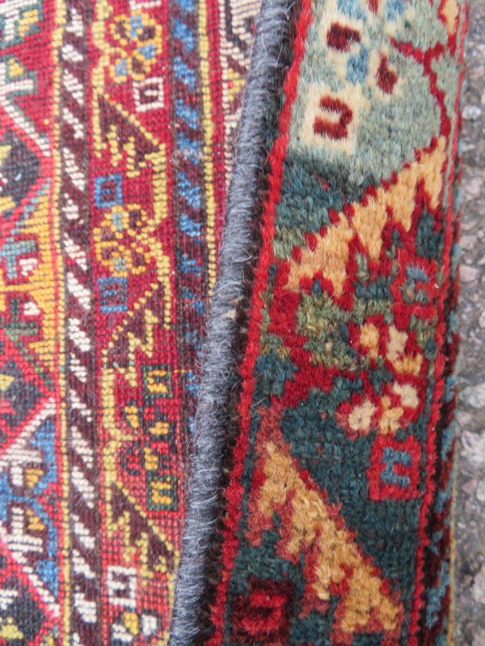 An antique hand-knotted Qashqai wool carpet with geometric bird, botanical motifs, and compound borders in deep red and navy blue. View XX
