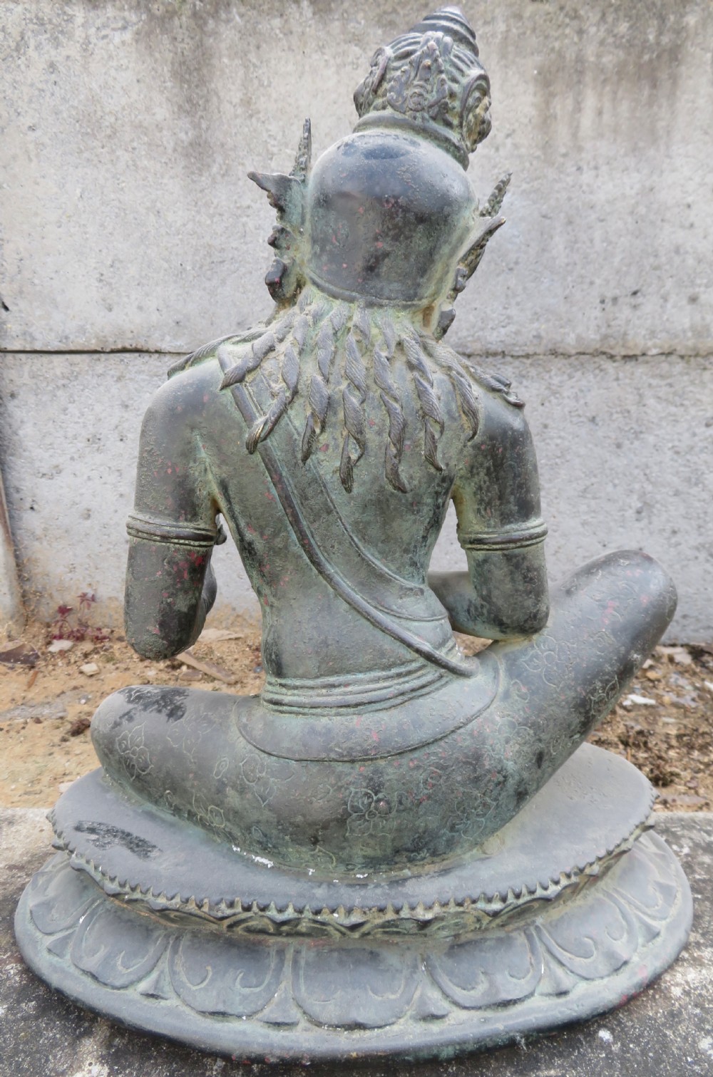 A dark bronze sculpture of a seated Bodhisattva Avalokitesvara featuring an ornate crown, beaded jewellery, and a double lotus pedestal base. View VIII