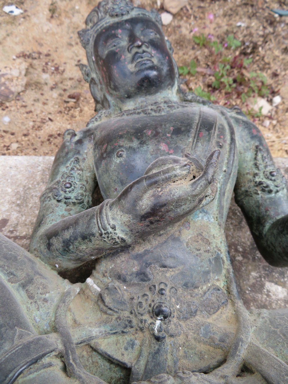 A dark bronze sculpture of a seated Bodhisattva Avalokitesvara featuring an ornate crown, beaded jewellery, and a double lotus pedestal base. View XI