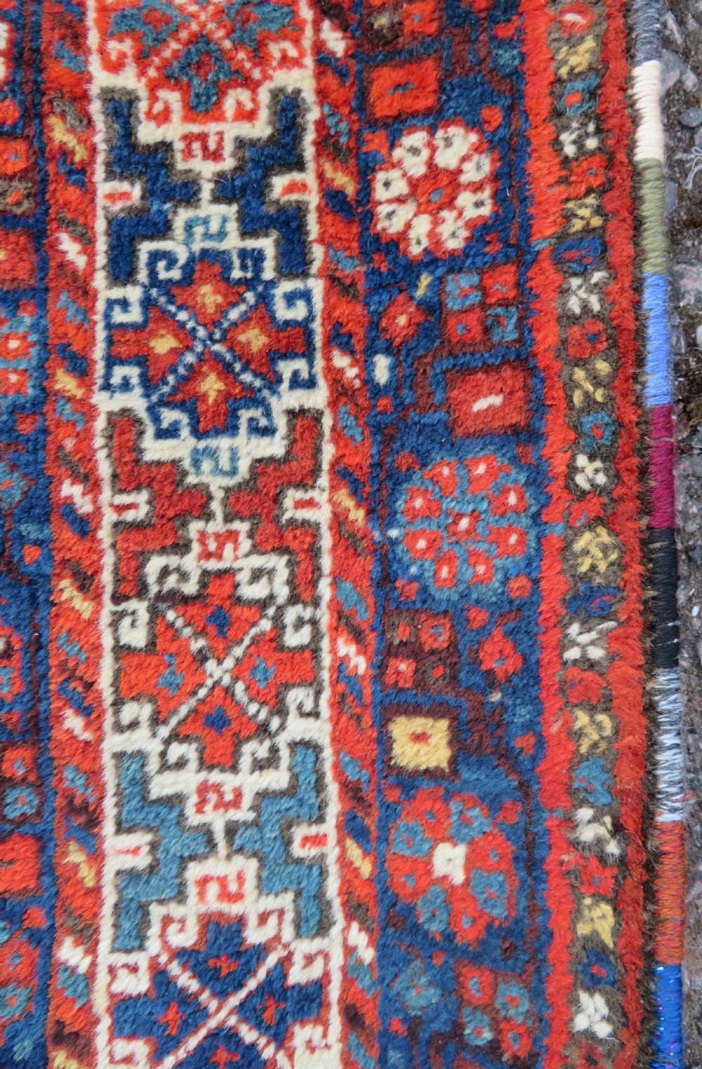 An antique Persian Khamseh carpet featuring three diamond-shaped central medallions and small bird motifs on a dark navy blue field with geometric borders. View XIII