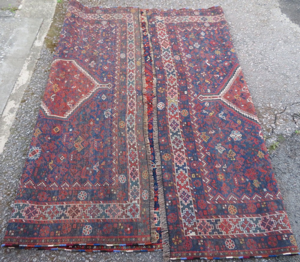 An antique Persian Khamseh carpet featuring three diamond-shaped central medallions and small bird motifs on a dark navy blue field with geometric borders. View XXIII