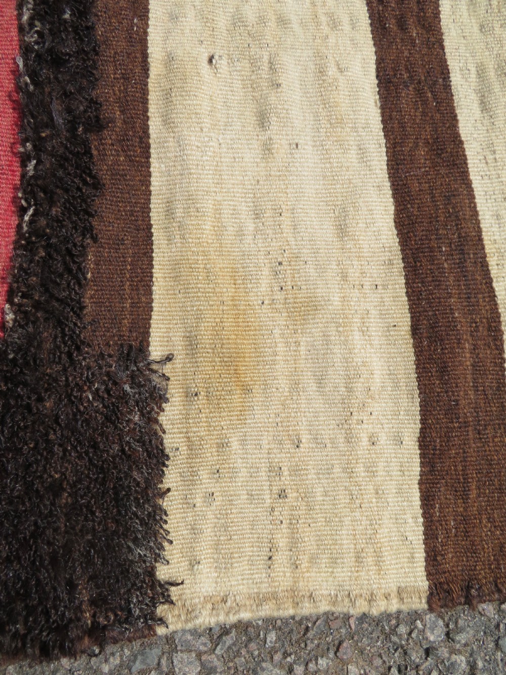 An antique flatweave Kurdish Tasheh wheat sack featuring vertical blue, red, cream, and brown stripes alongside a woven chevron motif. View VII
