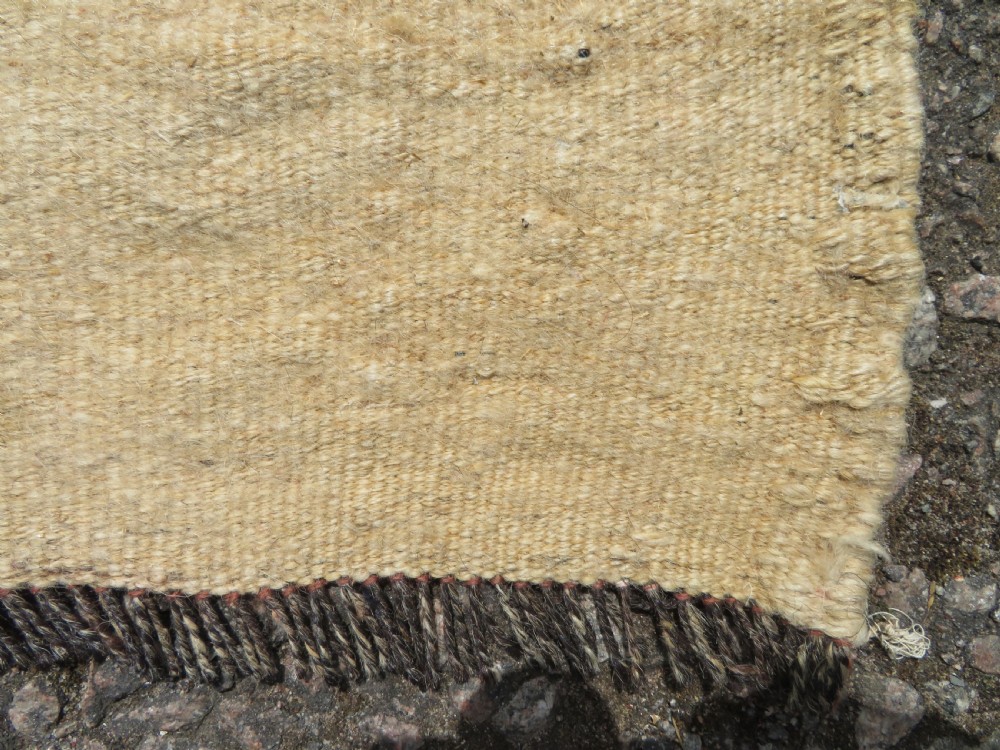 An antique flatweave Kurdish Tasheh wheat sack featuring vertical blue, red, cream, and brown stripes alongside a woven chevron motif. View XI