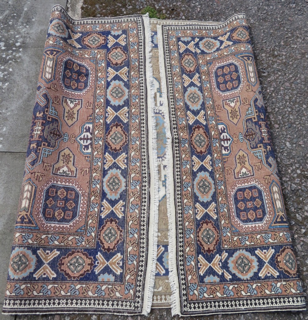 A hand-knotted North Persian Ardabil wool rug featuring three central geometric medallions in blue, cream, and beige on a neutral field with patterned borders. View XIII