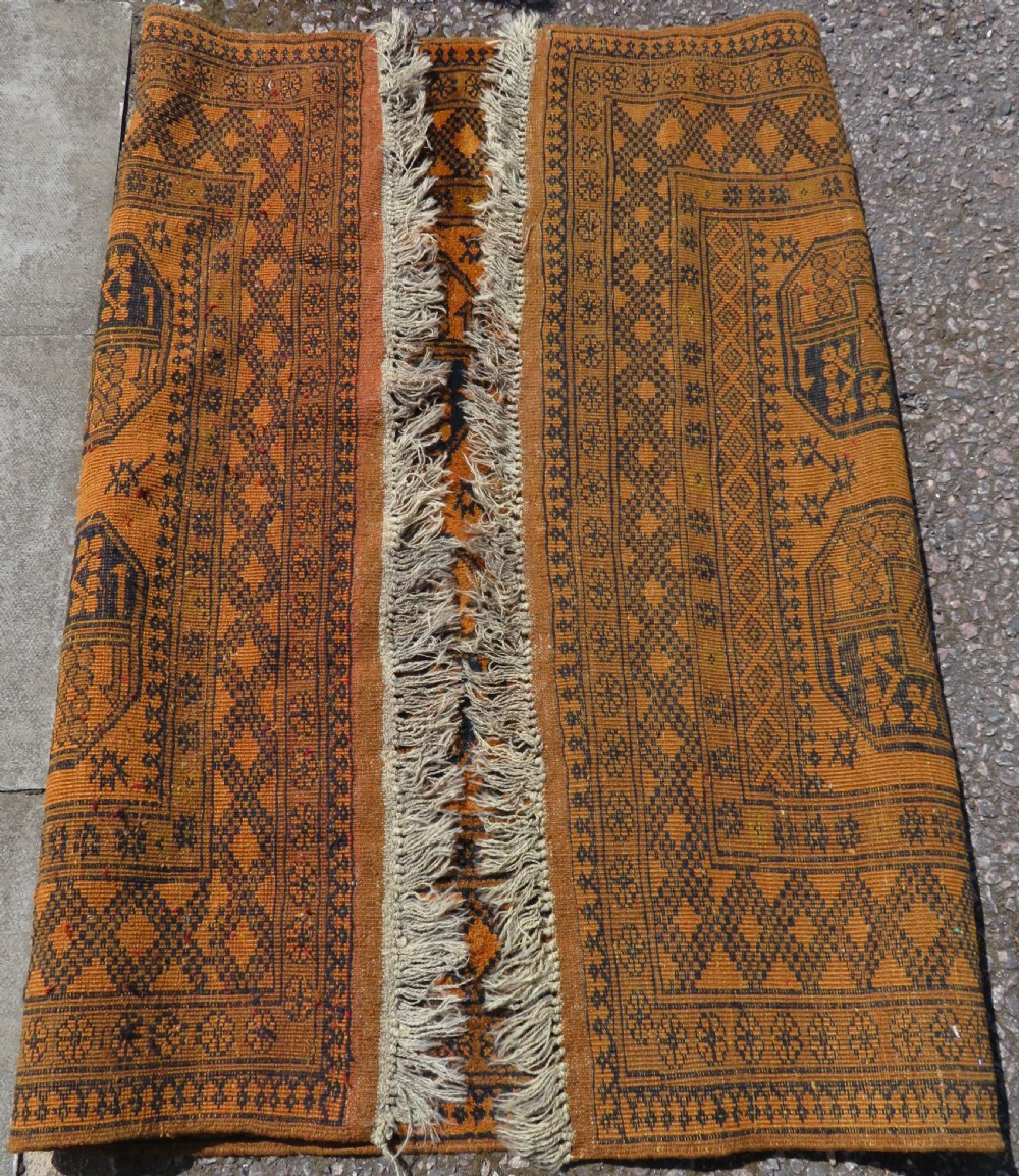 A rectangular hand-knotted Afghan wool rug with dark blue octagonal gul motifs set against a rich gold field with geometric borders. View XI