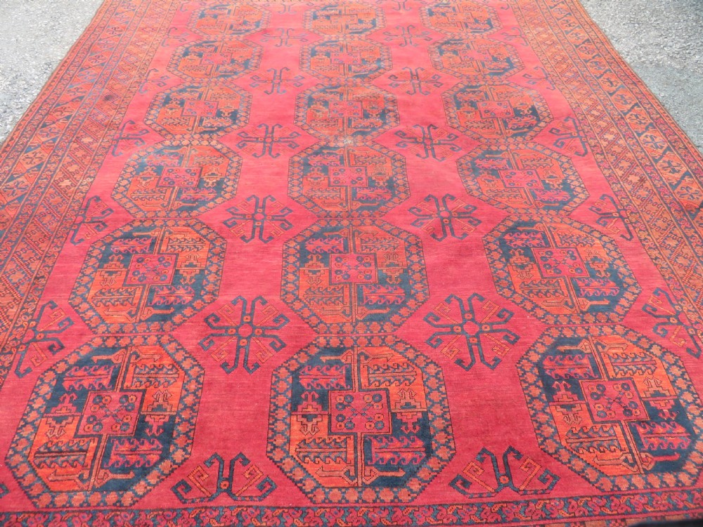 LARGE ANTIQUE AFGHAN ERSARI MAIN CARPET. CIRCA 1880. 427CM X 319CM. View X