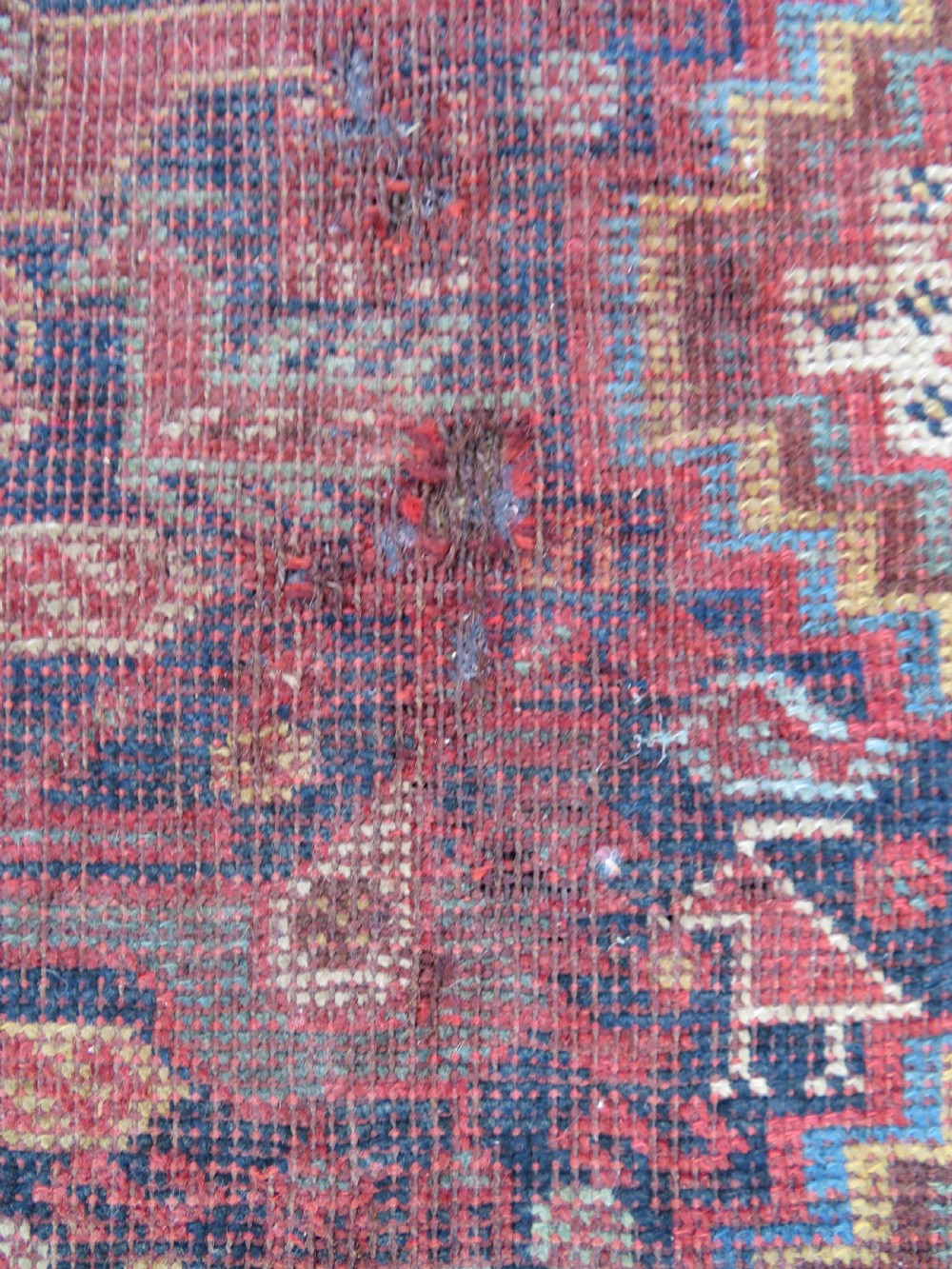An antique Khamseh nomadic wool rug featuring complex geometric medallions, bird motifs, and multi-layered borders in terracotta, navy blue, and cream. View XI