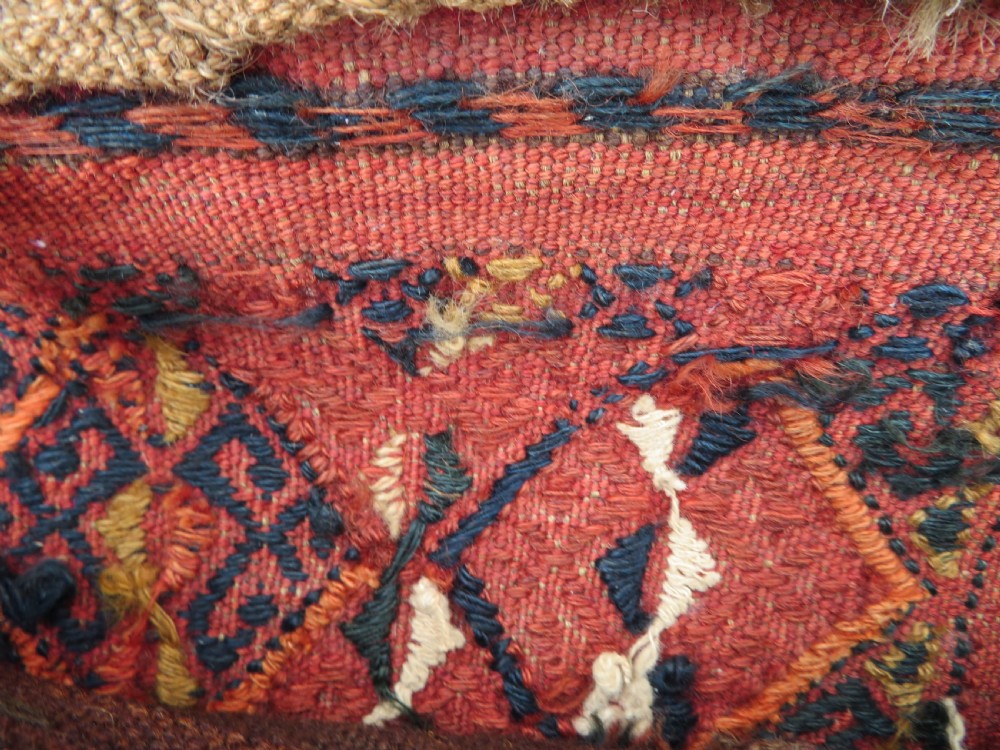 An Ersari Turkmen flatweave wool torba featuring geometric motifs in terracotta red, navy, and ivory, complete with a long fringed lower border. View XVII
